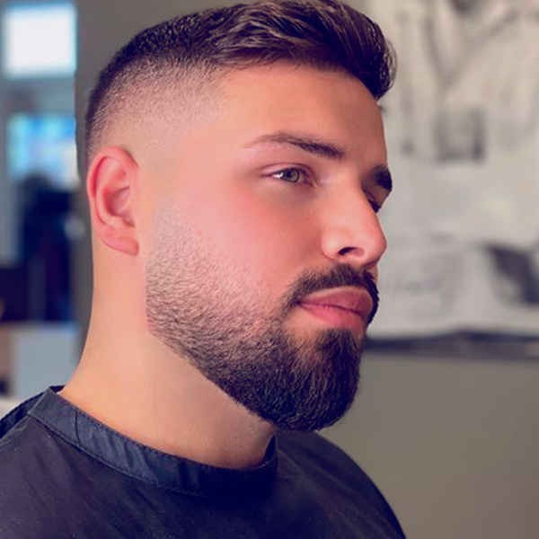 7 reglas para la barba que todos los hombres deberían seguir 6 Persona con barba degradada